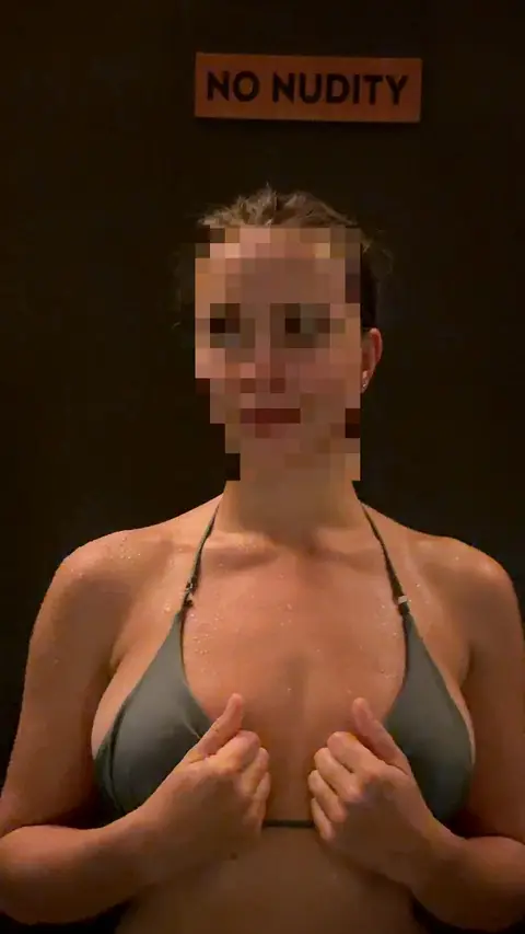 The 'No Nudity' warning sign made the topless reveal even bolder